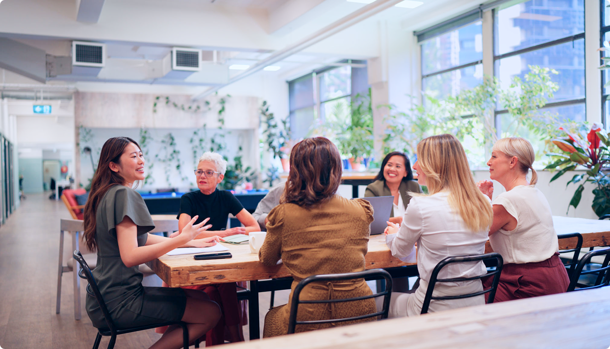 Colleagues collaborating in bright workspace